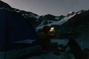 A camper at the campground looking at sunrise