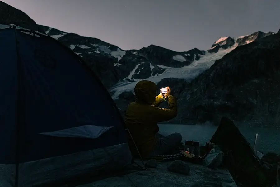 A camper at the campground looking at sunrise